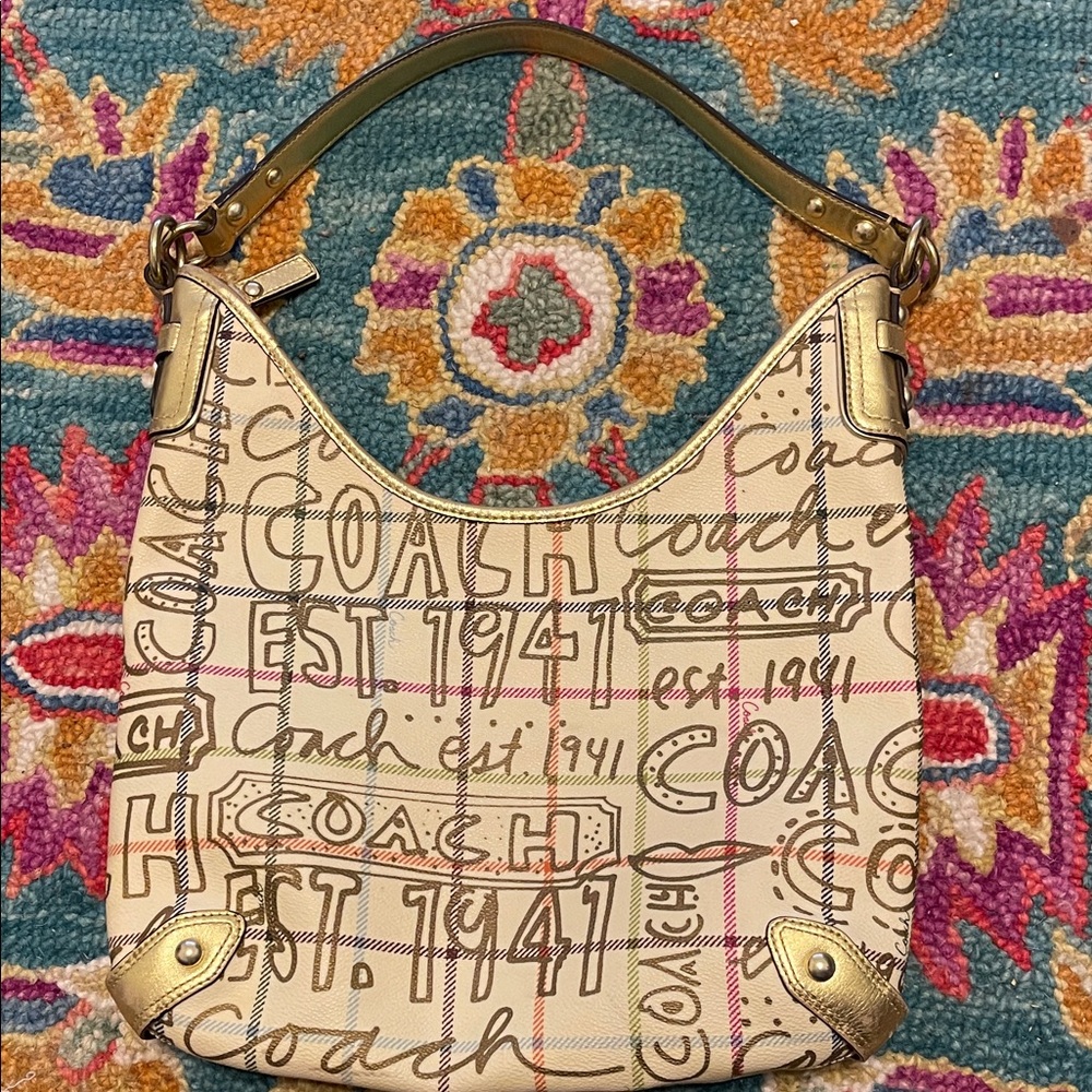 Uniquely beautiful Coach Cream Signature Script Shoulder Bag with Gold Accents